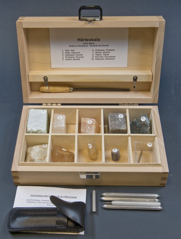 Numbered mineral samples in a Mohs hardness reference box